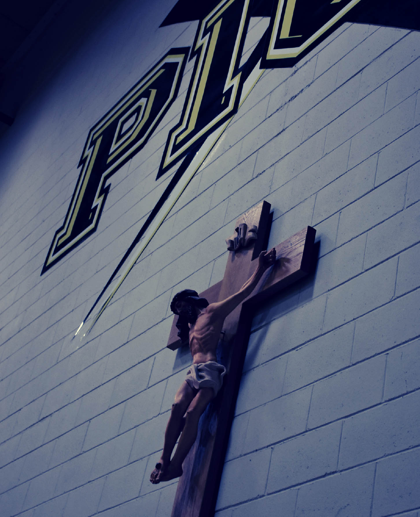 Pius X logo cross in gym b